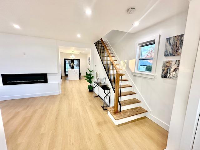 stairway featuring hardwood / wood-style floors