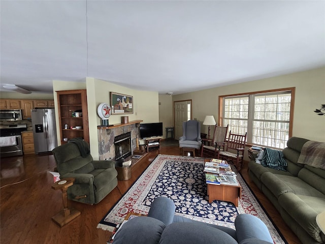 living room featuring a fireplace and dark hardwood / wood-style floors