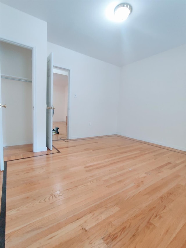 unfurnished bedroom with light hardwood / wood-style floors