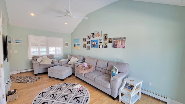 living room with ceiling fan, a baseboard heating unit, light hardwood / wood-style flooring, and lofted ceiling