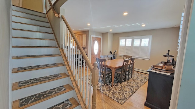 dining area featuring light hardwood / wood-style flooring and a baseboard radiator