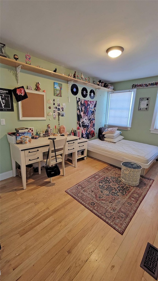 bedroom with light hardwood / wood-style flooring