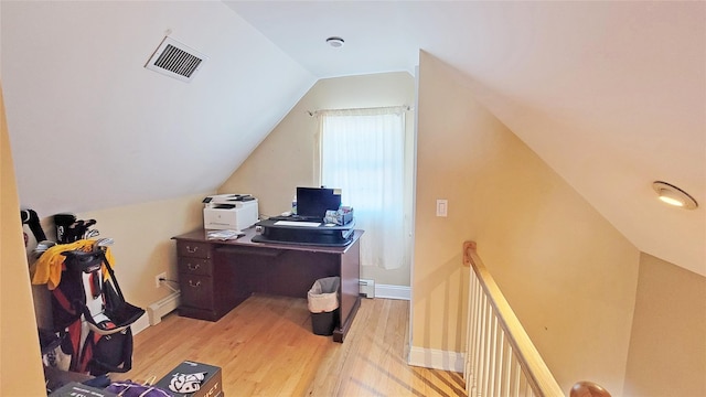 office area featuring a baseboard radiator, vaulted ceiling, and light wood-type flooring