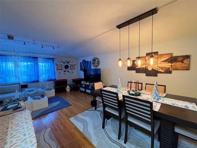 dining area with hardwood / wood-style flooring