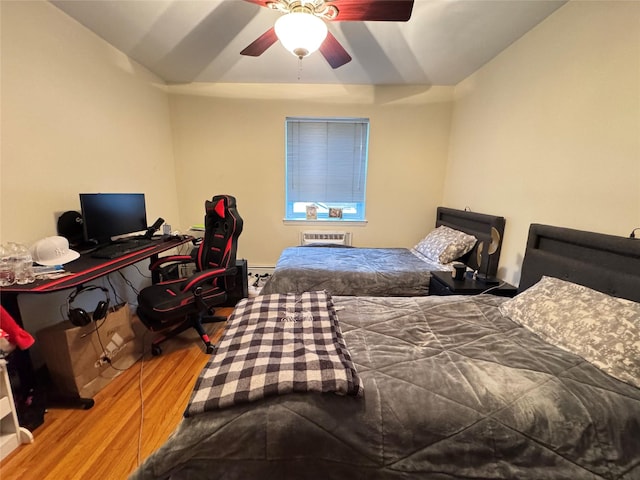 bedroom featuring ceiling fan and hardwood / wood-style flooring