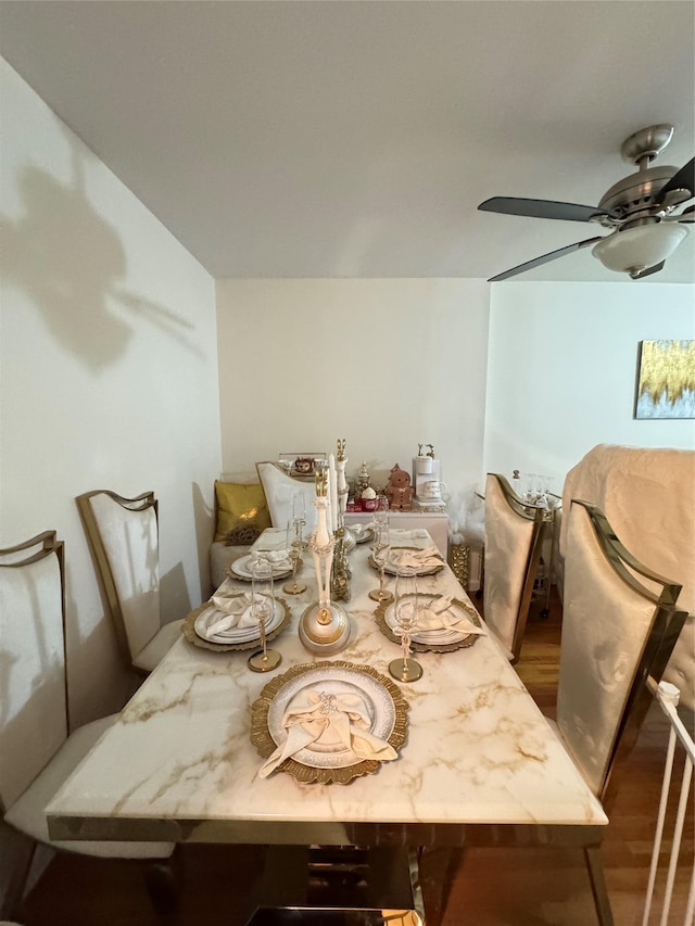 dining room featuring ceiling fan and wood-type flooring