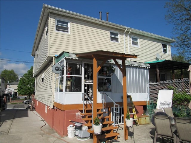 back of house with a patio area