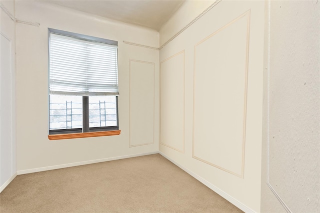 unfurnished room with light carpet