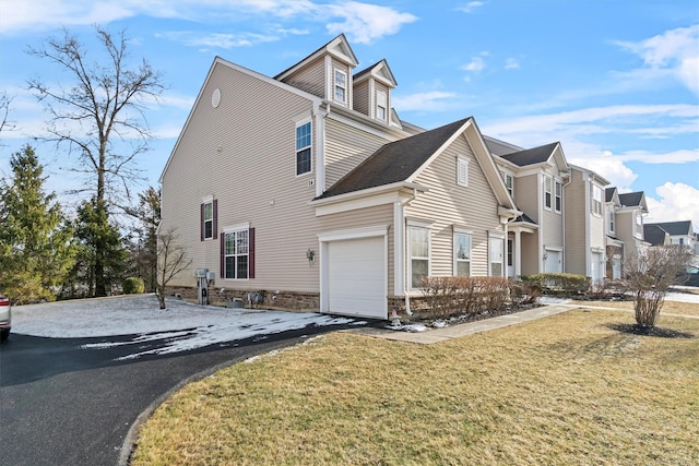 view of property exterior with a garage and a lawn