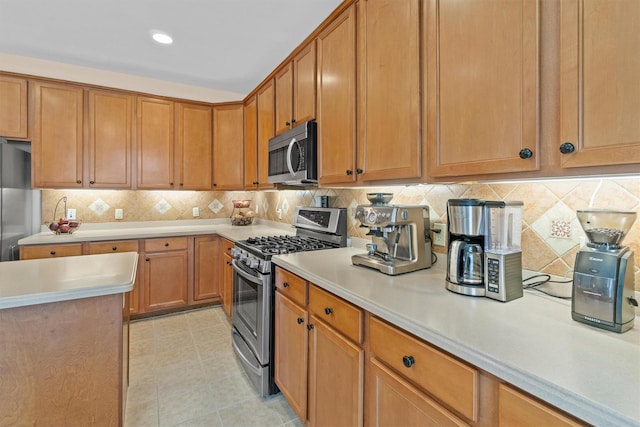 kitchen featuring decorative backsplash and stainless steel appliances