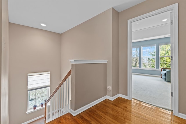 hallway with light hardwood / wood-style flooring