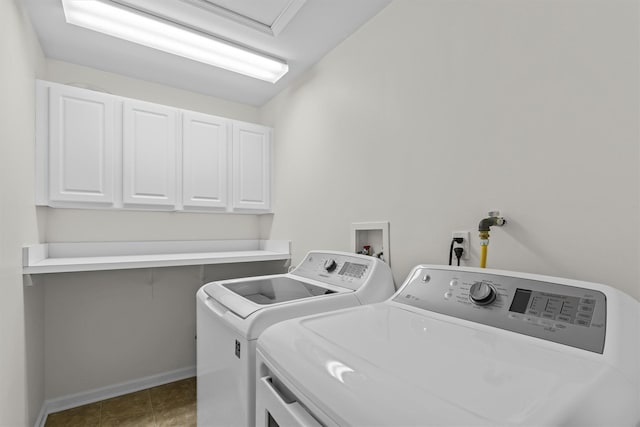 washroom with cabinets and independent washer and dryer