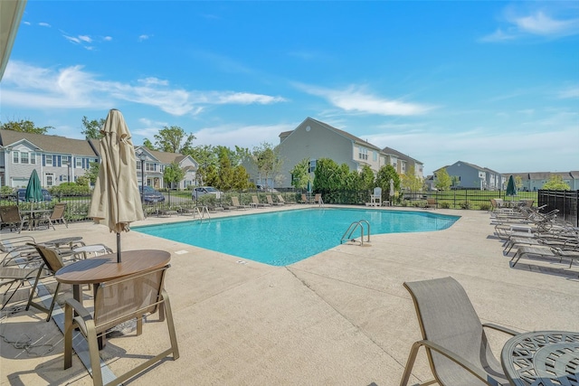 view of swimming pool featuring a patio area