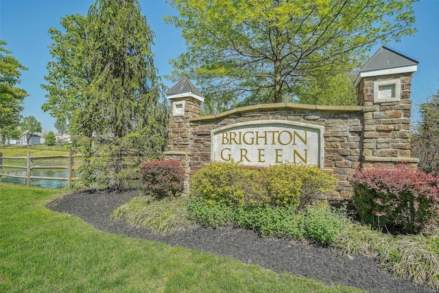 community sign featuring a water view