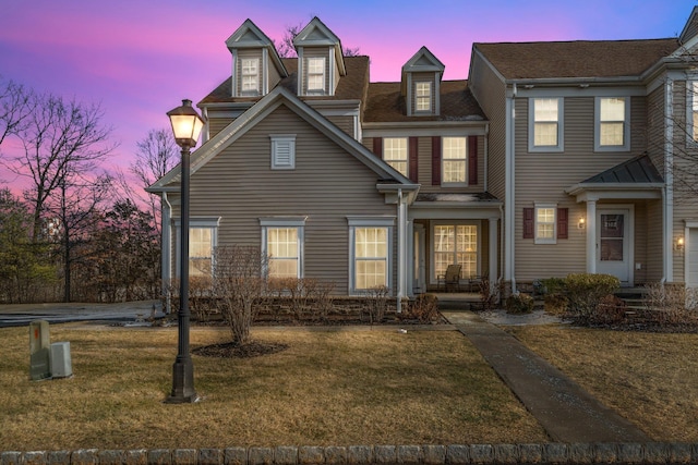 view of front of home with a yard