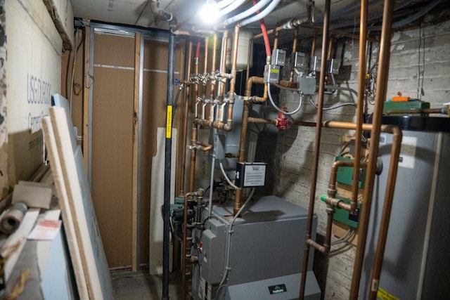 utility room with water heater