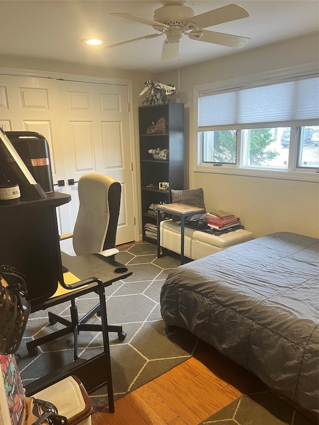 bedroom featuring ceiling fan and dark hardwood / wood-style floors