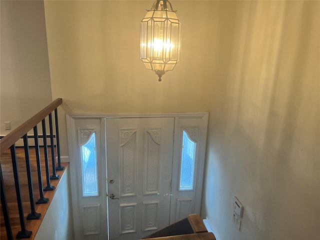 foyer featuring a chandelier