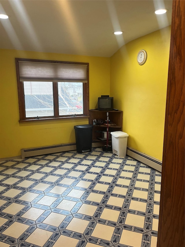 office with baseboard heating and lofted ceiling