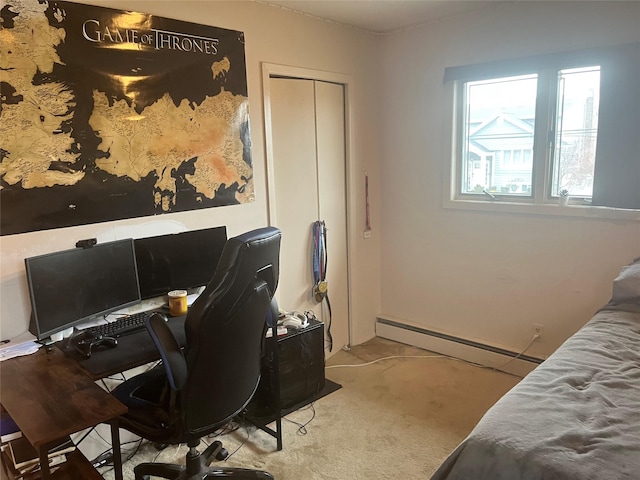 carpeted bedroom featuring a closet and a baseboard heating unit