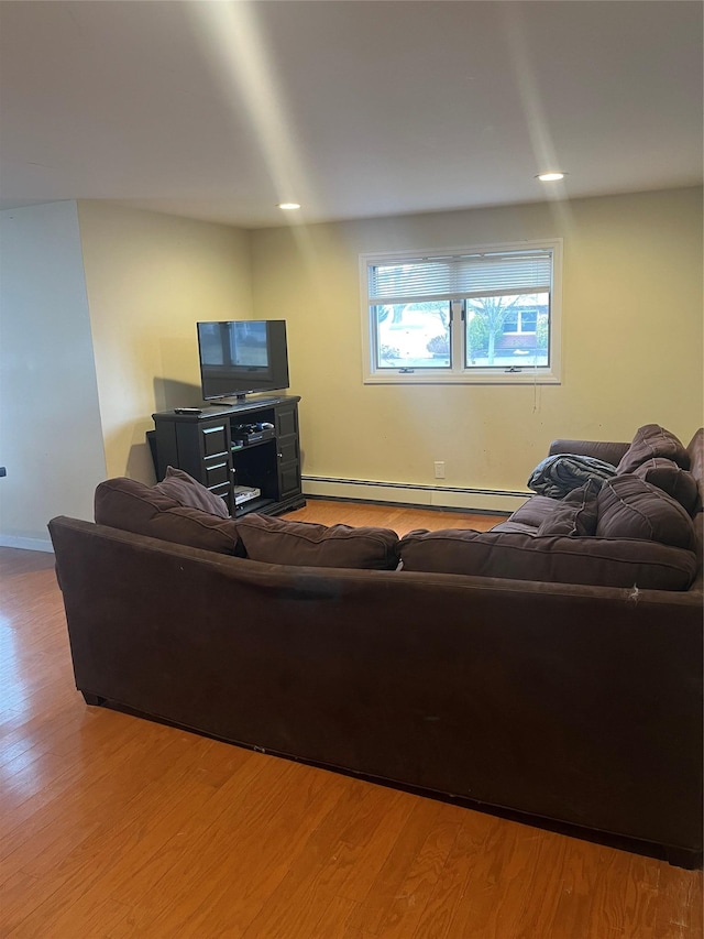 living room with hardwood / wood-style flooring and baseboard heating