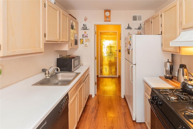 kitchen featuring light brown cabinetry, sink, range hood, light hardwood / wood-style floors, and black appliances