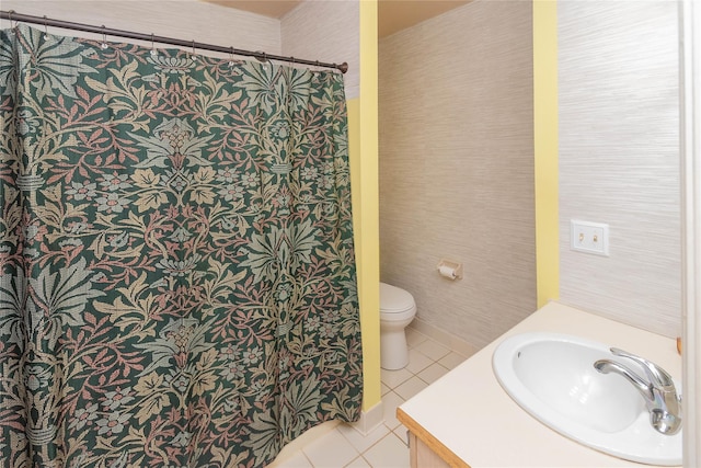 bathroom featuring tile patterned floors, toilet, a shower with shower curtain, and vanity