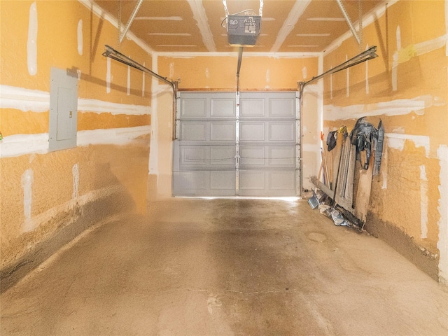 garage with a garage door opener and electric panel