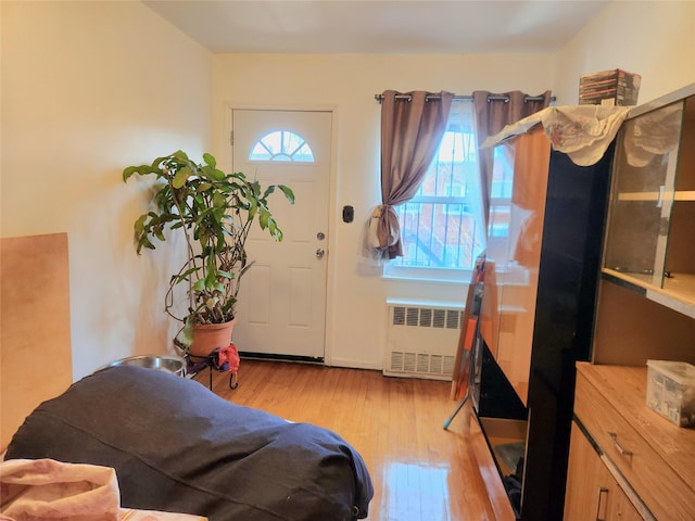 entryway featuring radiator and light wood-type flooring