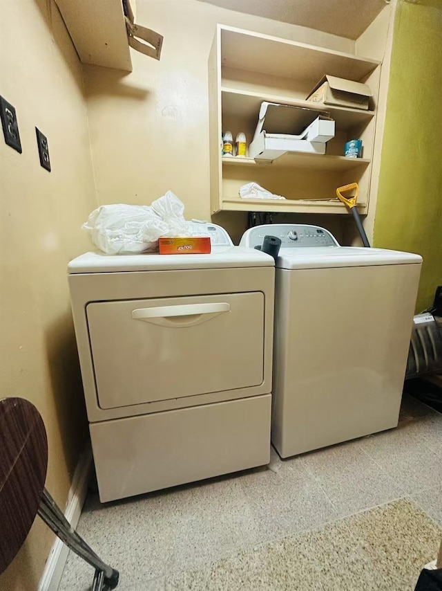 laundry area featuring washing machine and clothes dryer