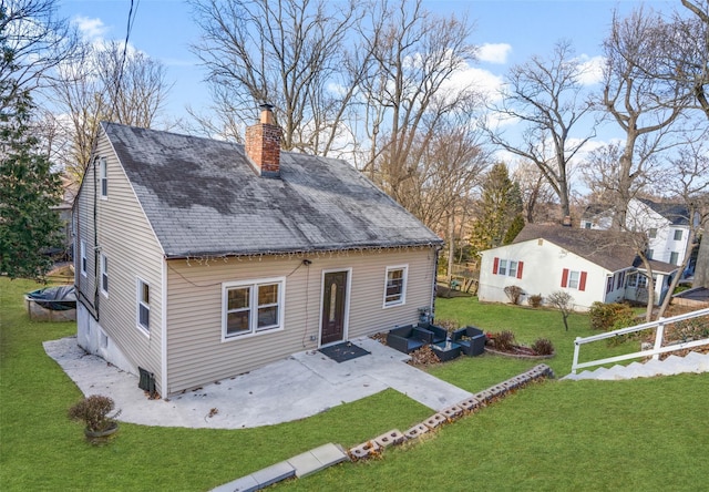 rear view of property with a patio, an outdoor hangout area, and a yard