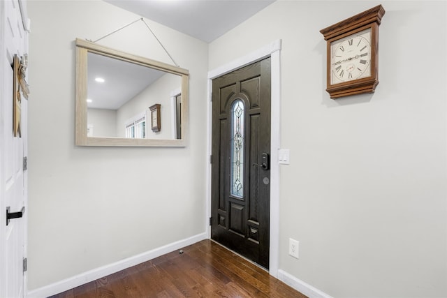 entryway with dark wood-type flooring