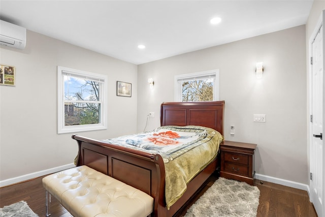 bedroom with a wall mounted air conditioner and dark hardwood / wood-style floors