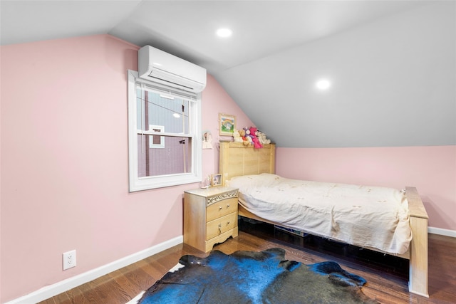 bedroom featuring lofted ceiling, dark hardwood / wood-style flooring, and a wall unit AC