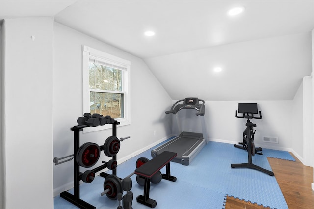 workout area featuring lofted ceiling