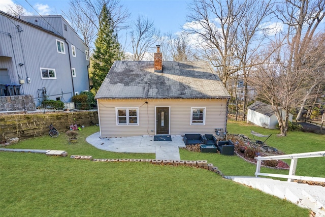 rear view of house featuring a patio, a lawn, and an outdoor hangout area