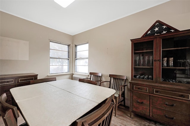 dining area with hardwood / wood-style floors