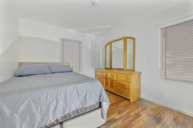 bedroom with hardwood / wood-style floors