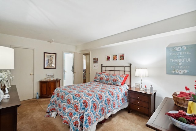 bedroom with light colored carpet