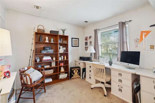 office area featuring light colored carpet and visible vents