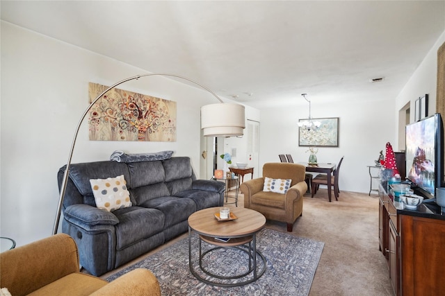 living area with light carpet, a notable chandelier, and visible vents