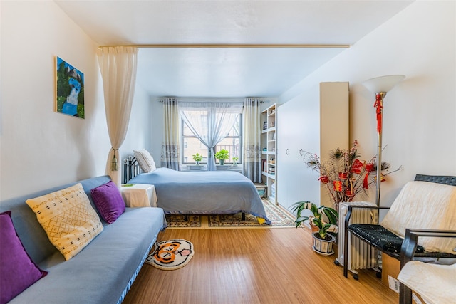 bedroom with hardwood / wood-style floors