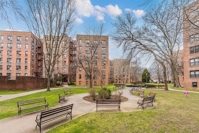 view of property's community featuring a yard