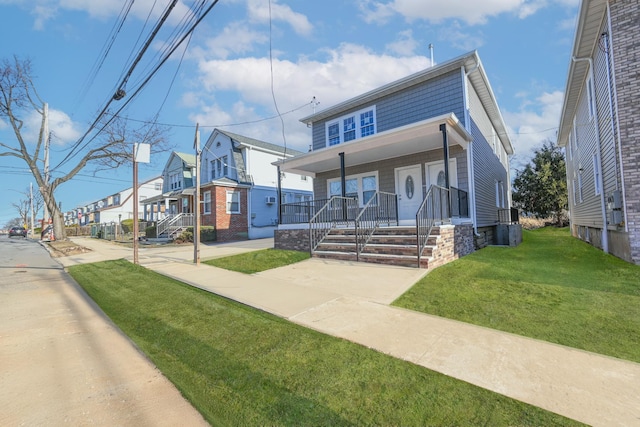 view of front facade with a porch and a front yard