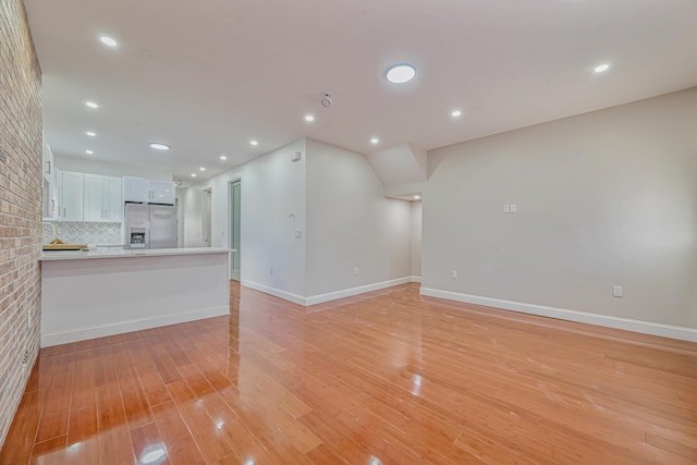 unfurnished living room with light hardwood / wood-style floors