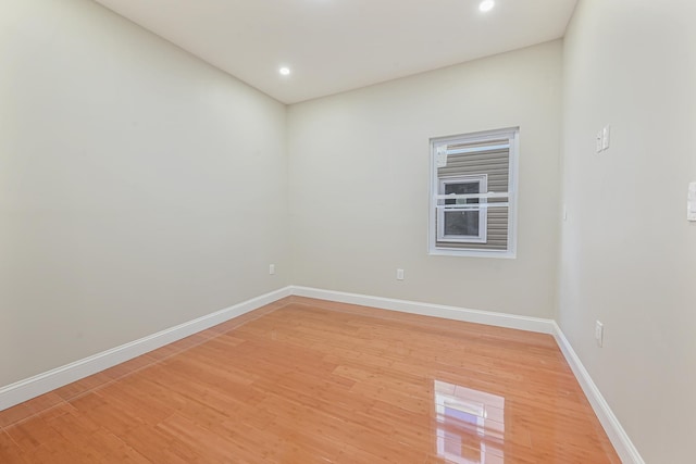 unfurnished room with hardwood / wood-style floors