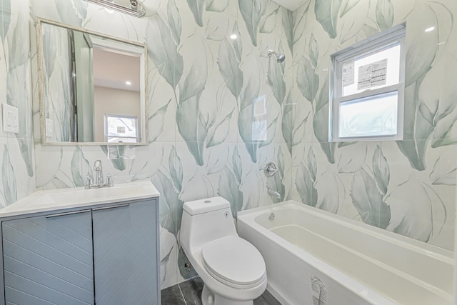 full bathroom featuring toilet, a wealth of natural light, tile walls, and vanity