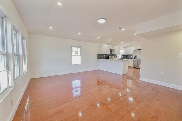 unfurnished living room featuring light wood-type flooring