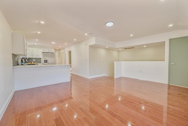 unfurnished living room with light wood-type flooring