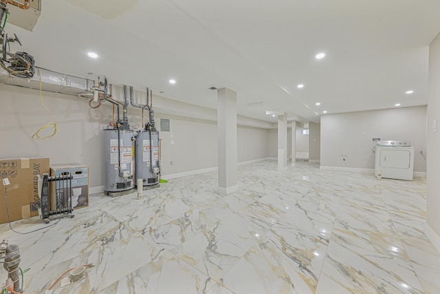 basement featuring water heater and washer / clothes dryer